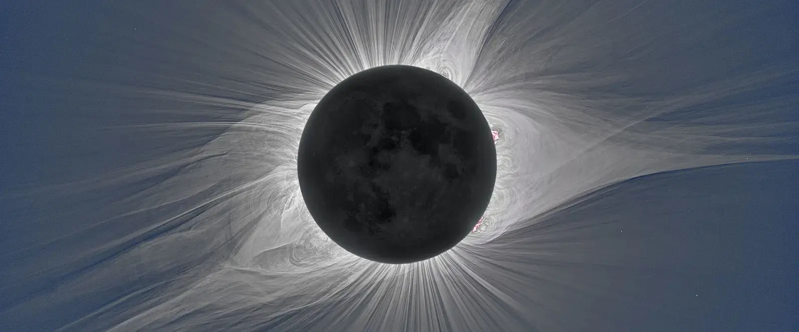 The Sun’s corona during a total eclipse, with fine streamers spreading out from the dark Moon