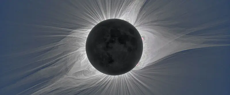 The Sun’s corona during a total eclipse, with fine streamers spreading out from the dark Moon